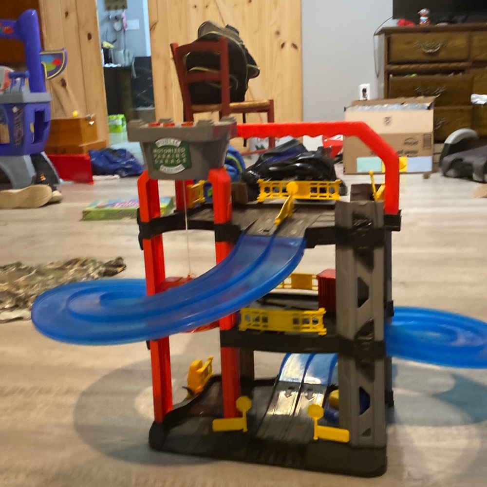 Helicopter landing pad with race car track